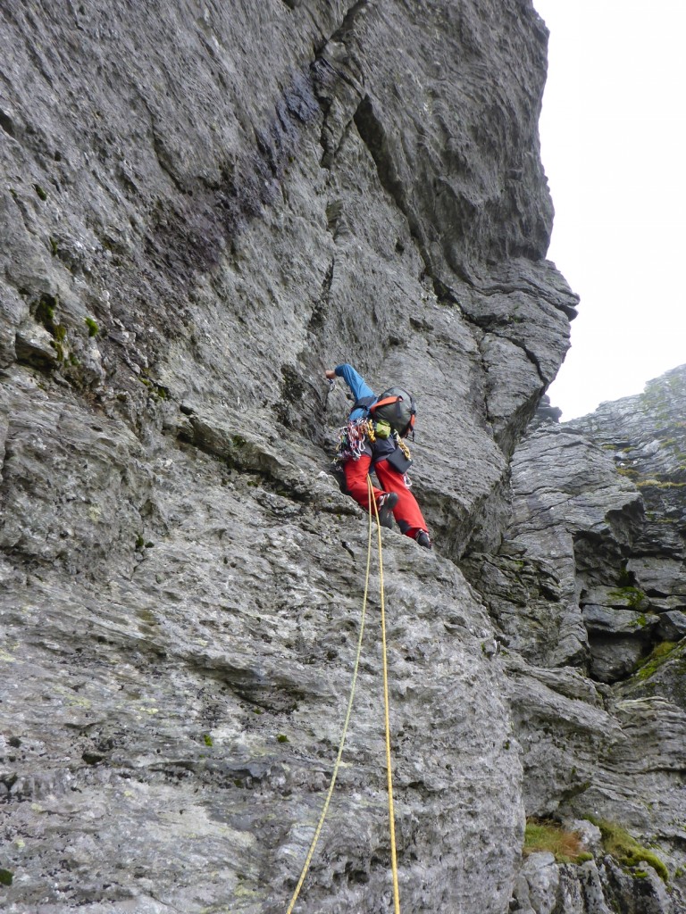 Heading for the traverse on a damp Punster's Crack