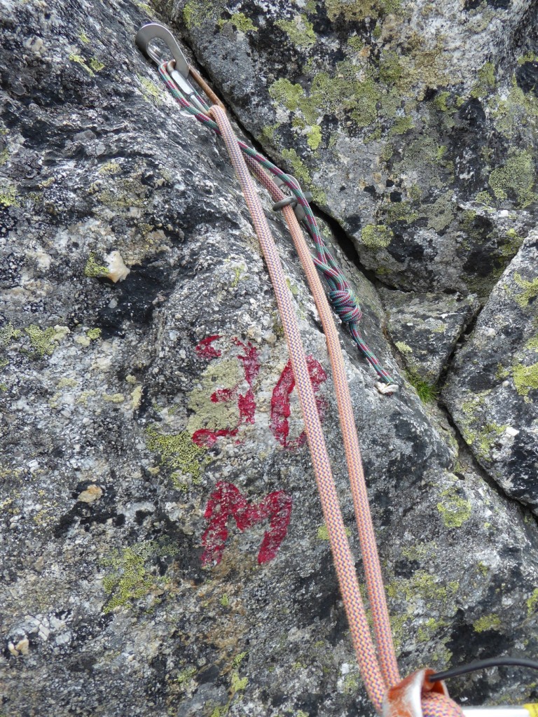 The normal route leads round the North side of the 1st Tower, and there's a choice of a loose scramble down or a more direct abseil. We thought we'd go for the abseil, but then saw the writing on the rock - presumably written by a local guide to help people out. The only problem with the 30m label was that we only had a single 50m rope with us that day.....